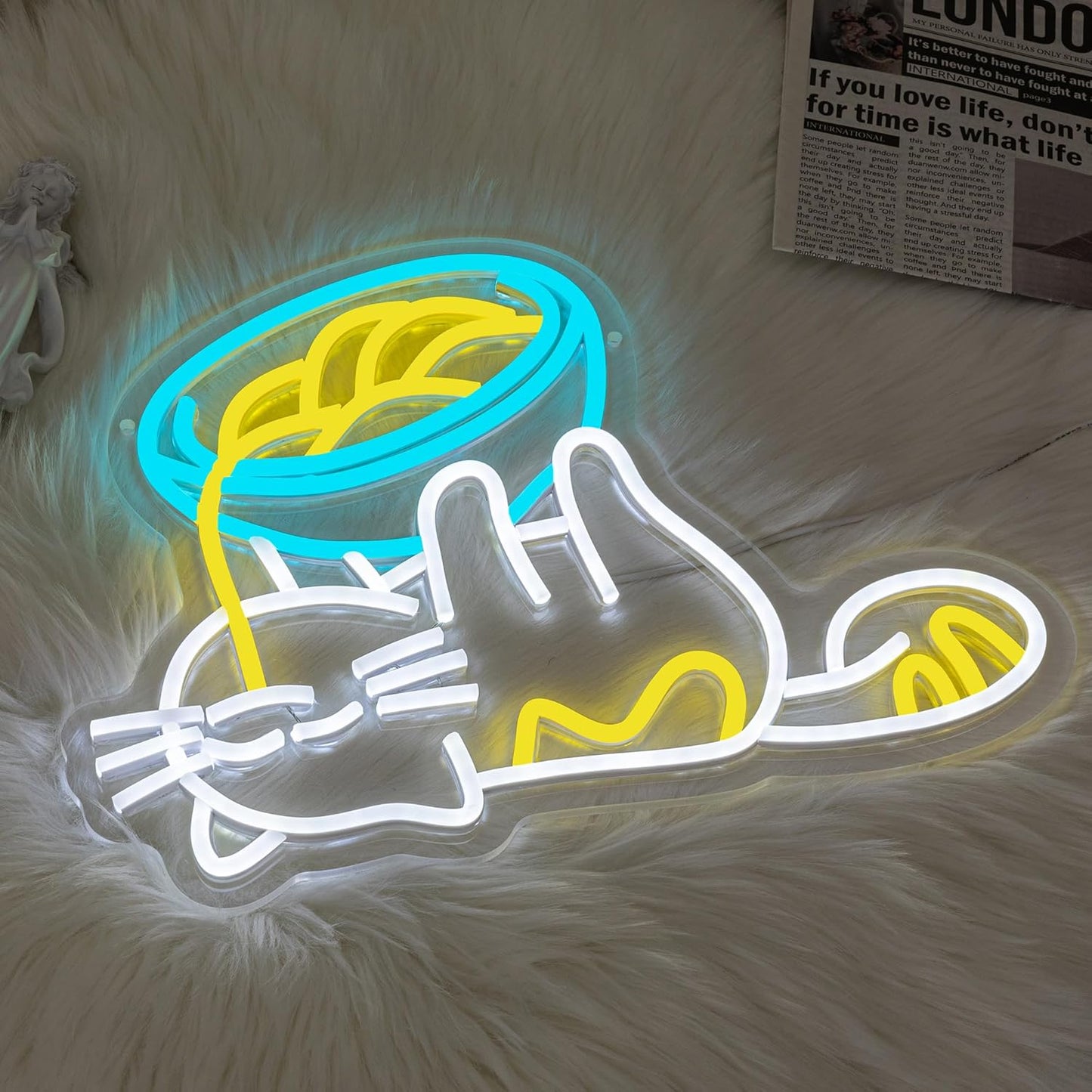 LED neon sign with cat lying under noodles bowl