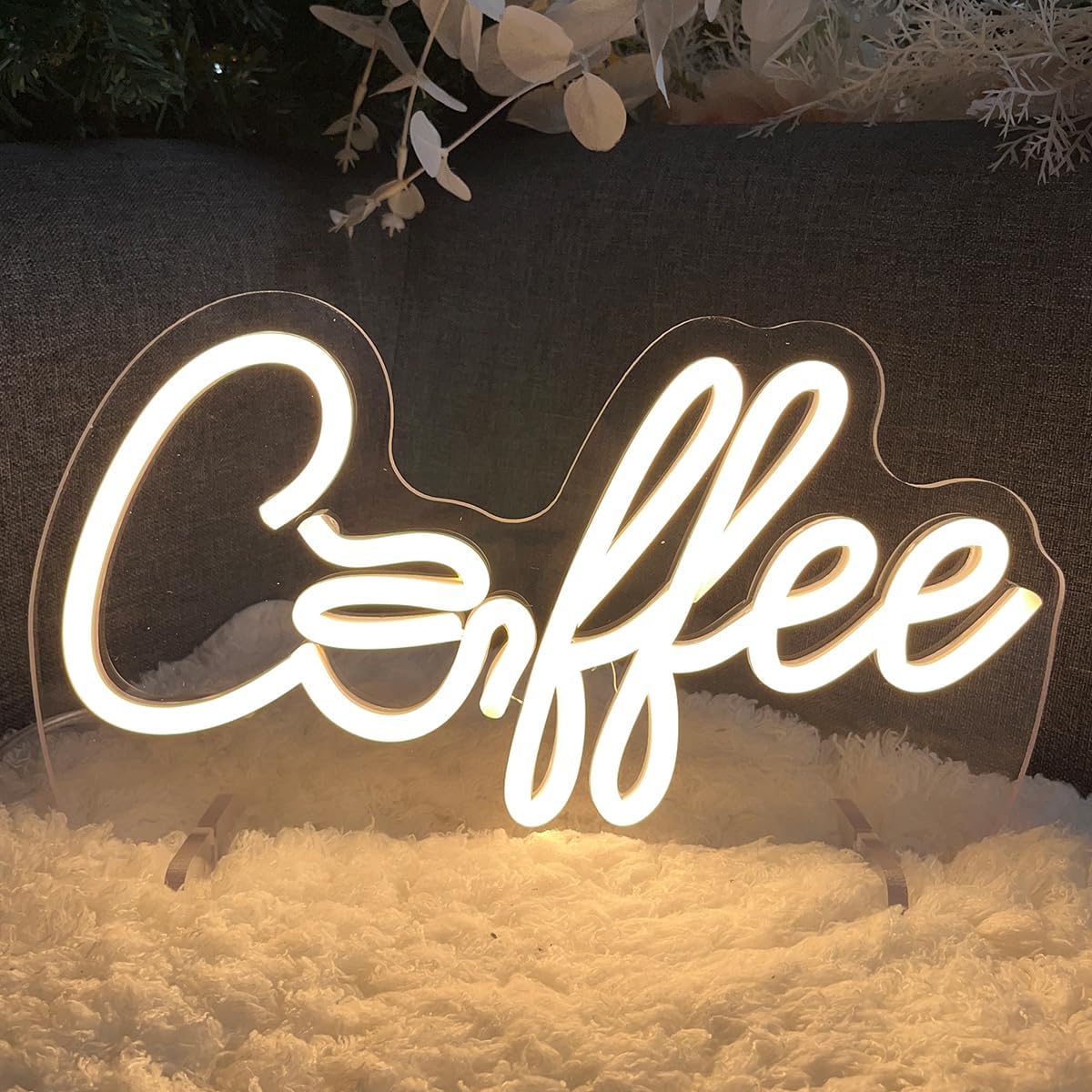 Glowing LED neon sign with the word "coffee", perfect for café, coffee bar, or kitchen wall decor.