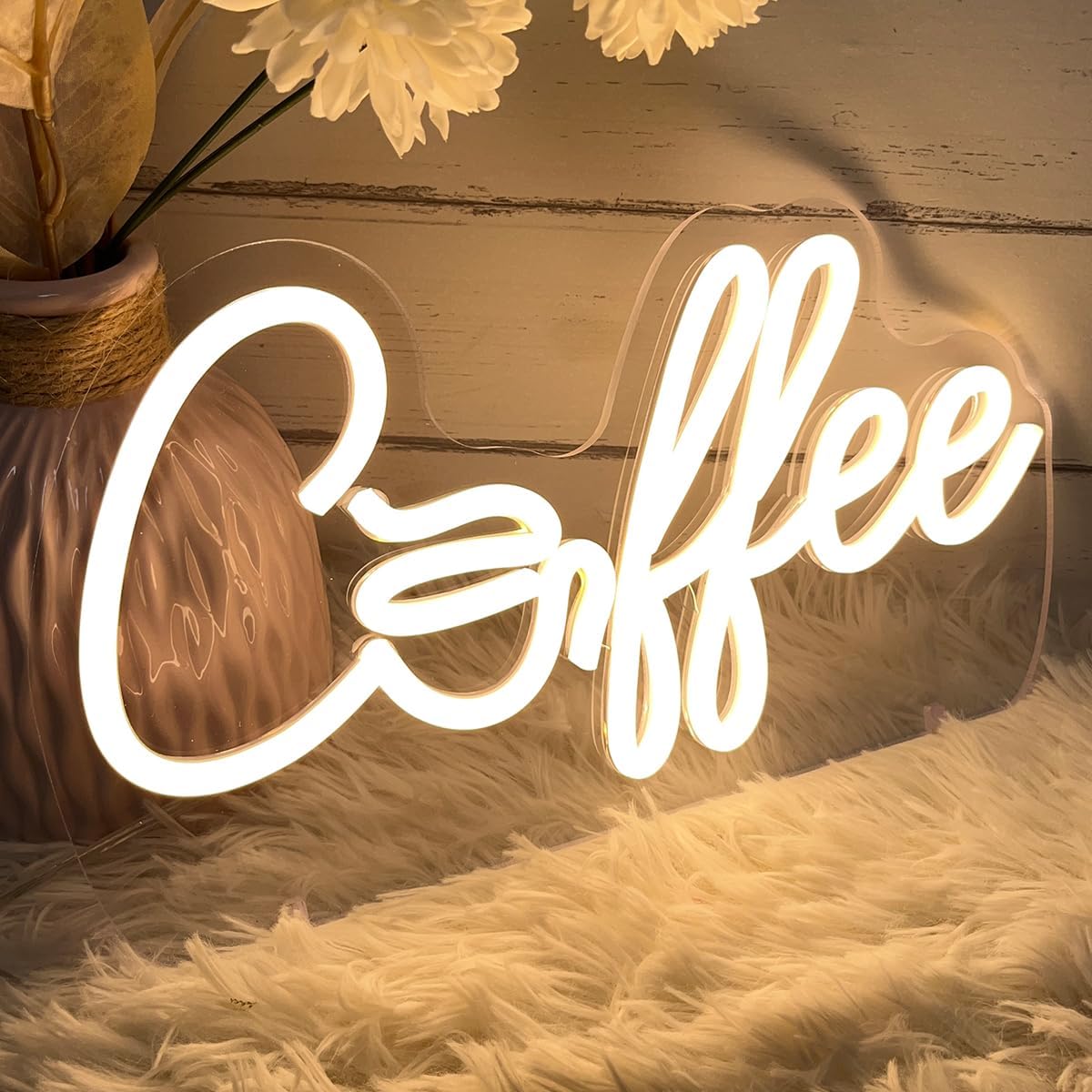 Glowing LED neon sign with the word "coffee", perfect for café, coffee bar, or kitchen wall decor.
