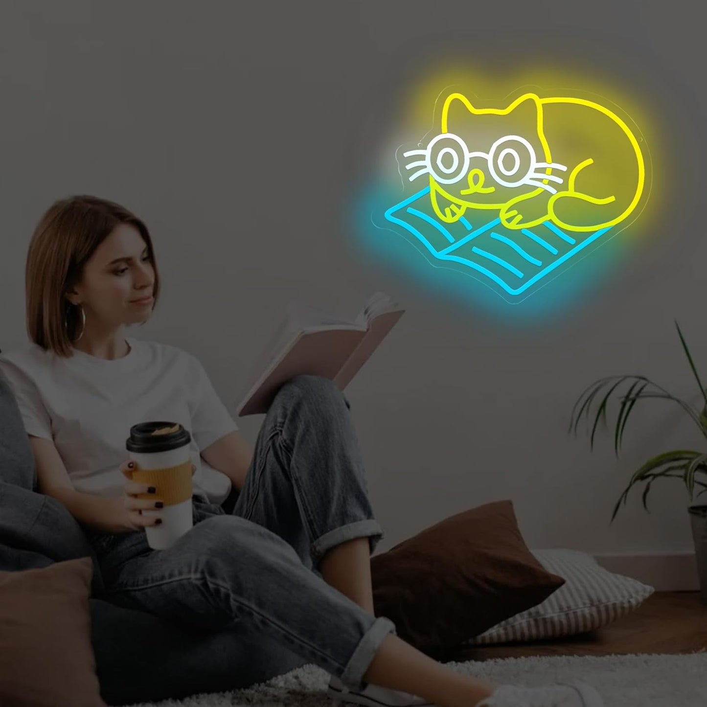 Neon sign of cat lying down and reading a book