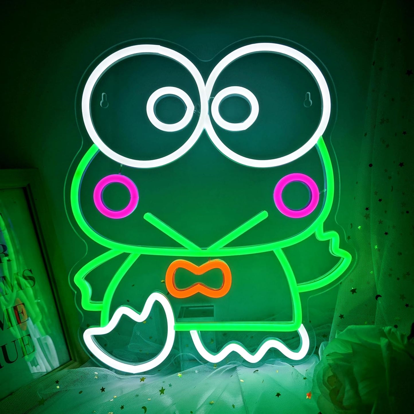 Green frog character neon sign with large eyes and pink cheeks, cute cartoon LED wall decor for kids room or kawaii spaces