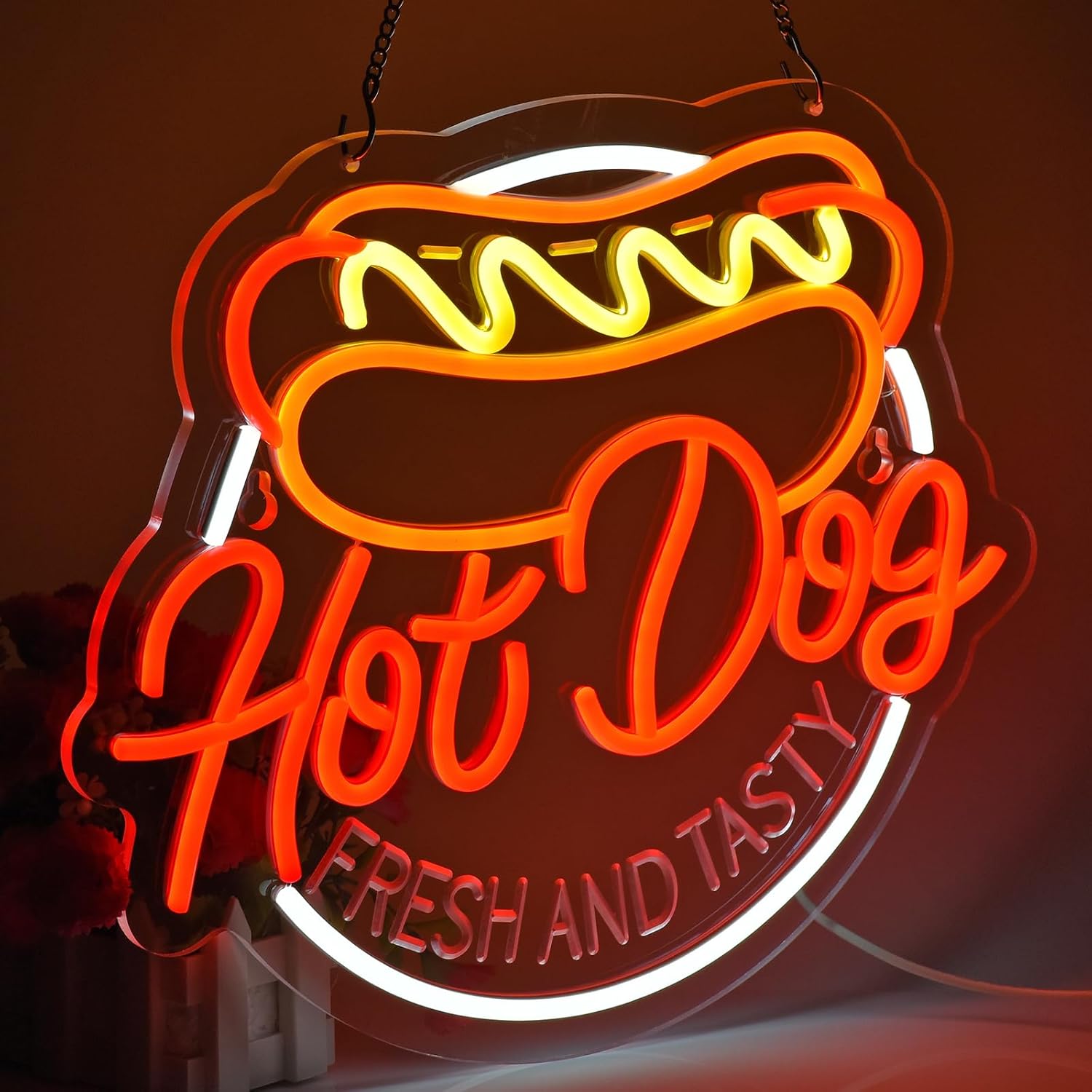 Hot dog neon sign with text “Fresh and Tasty” in red, yellow, and white LED lighting