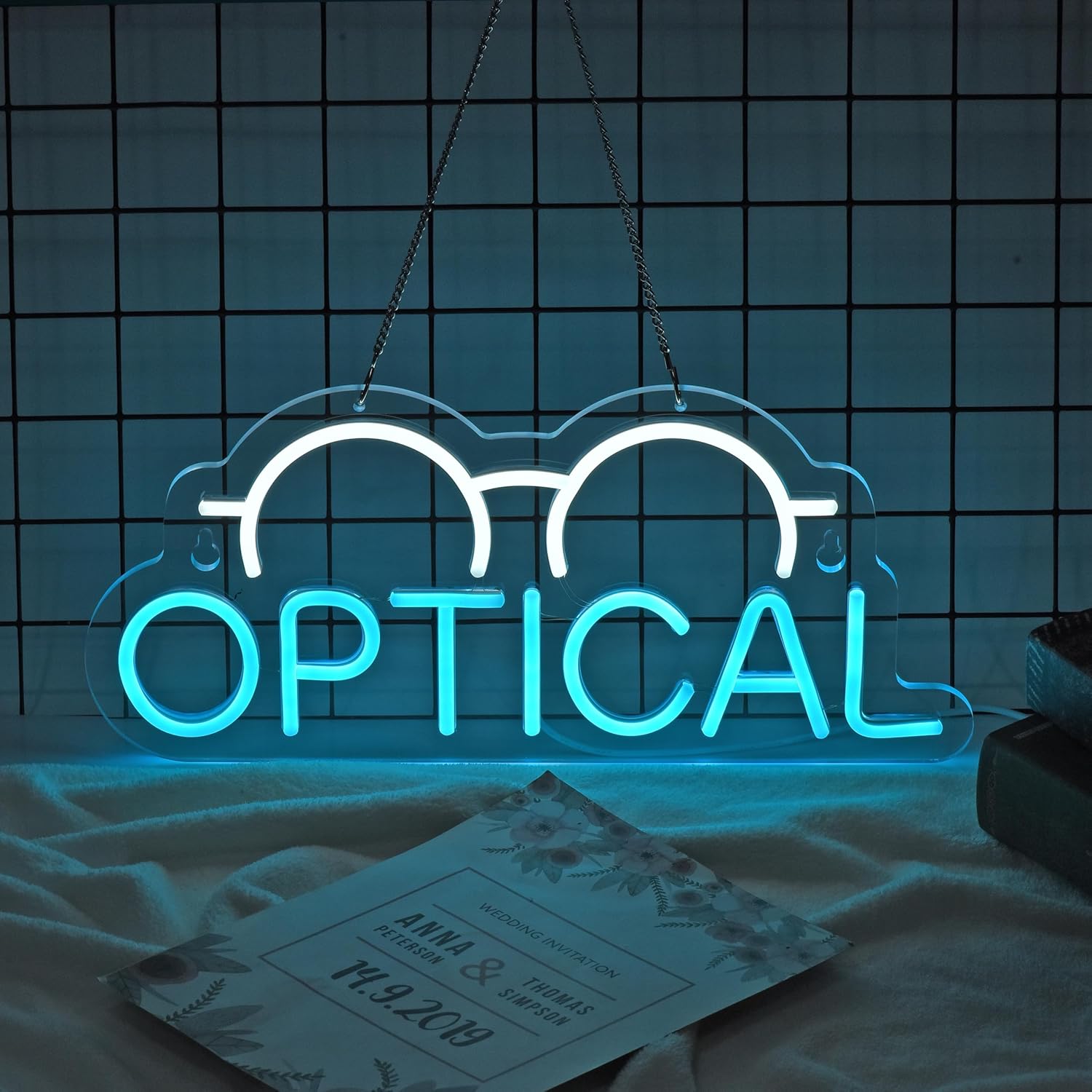 Neon sign with eyeglasses icon and OPTICAL text for eyewear store decor