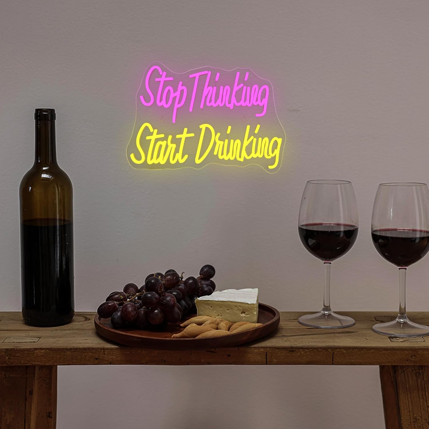 LED neon sign with the quote "Stop Thinking Start Drinking" for bar and party wall decor
