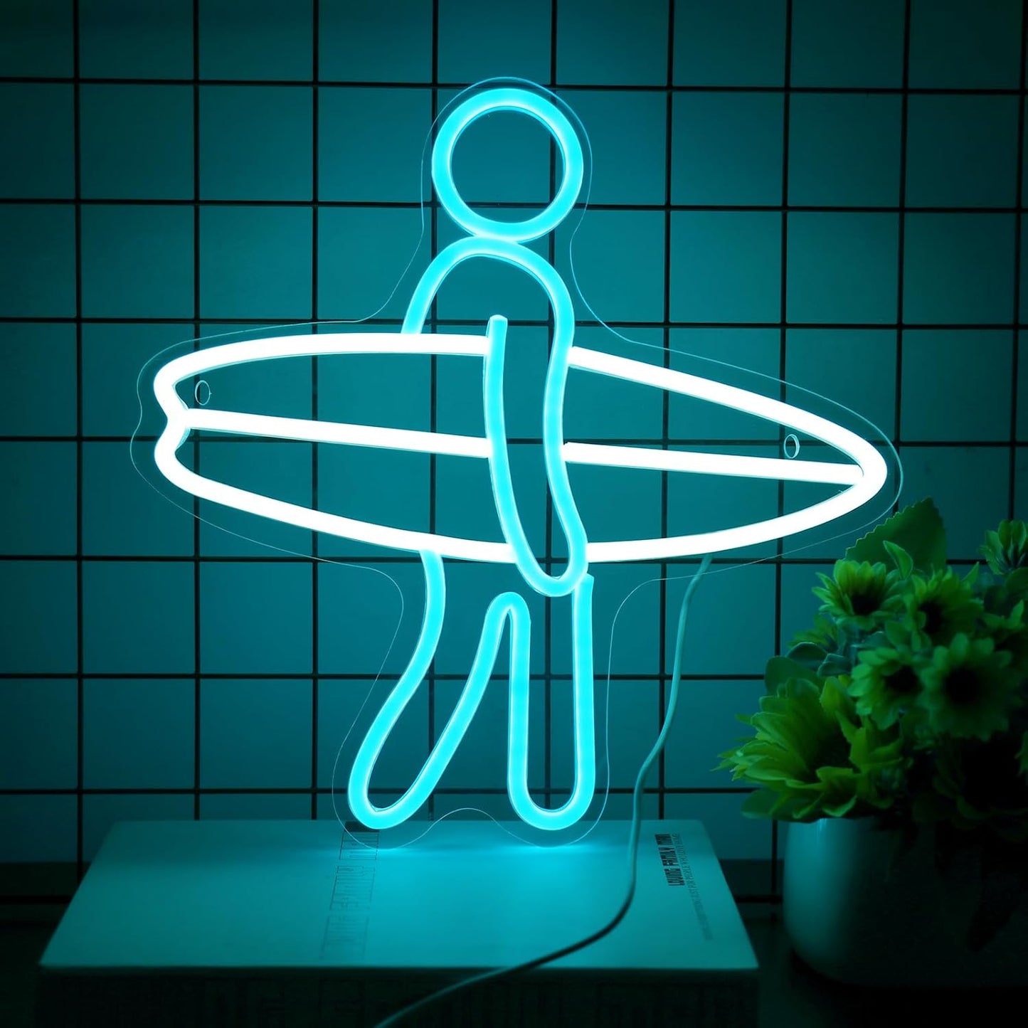 LED neon sign of a surfer holding a surfboard, glowing wall decor for beach lovers and surf-themed rooms