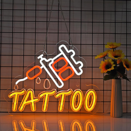 LED tattoo neon sign in red and orange featuring a tattoo machine and dripping ink