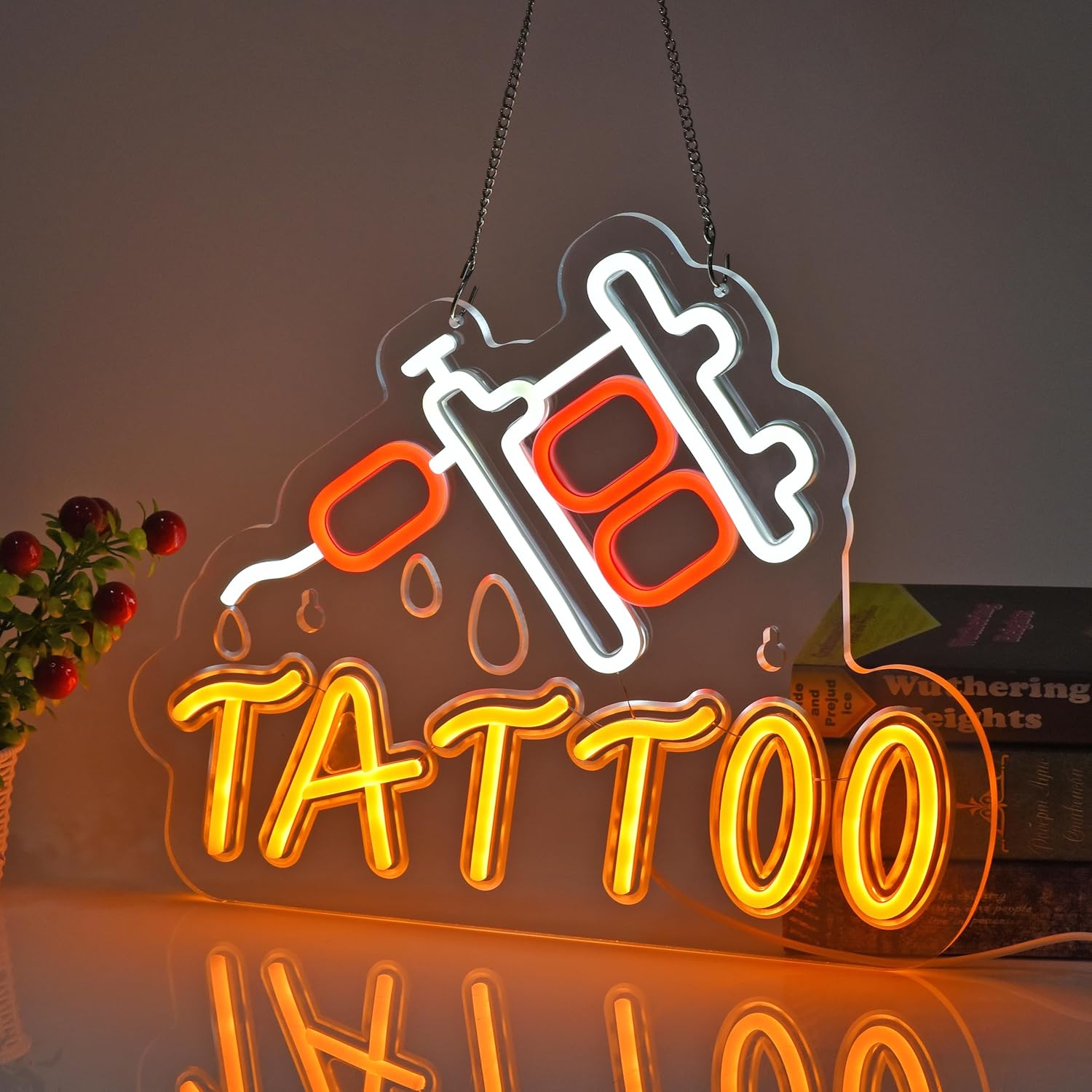 LED tattoo neon sign in red and orange featuring a tattoo machine and dripping ink