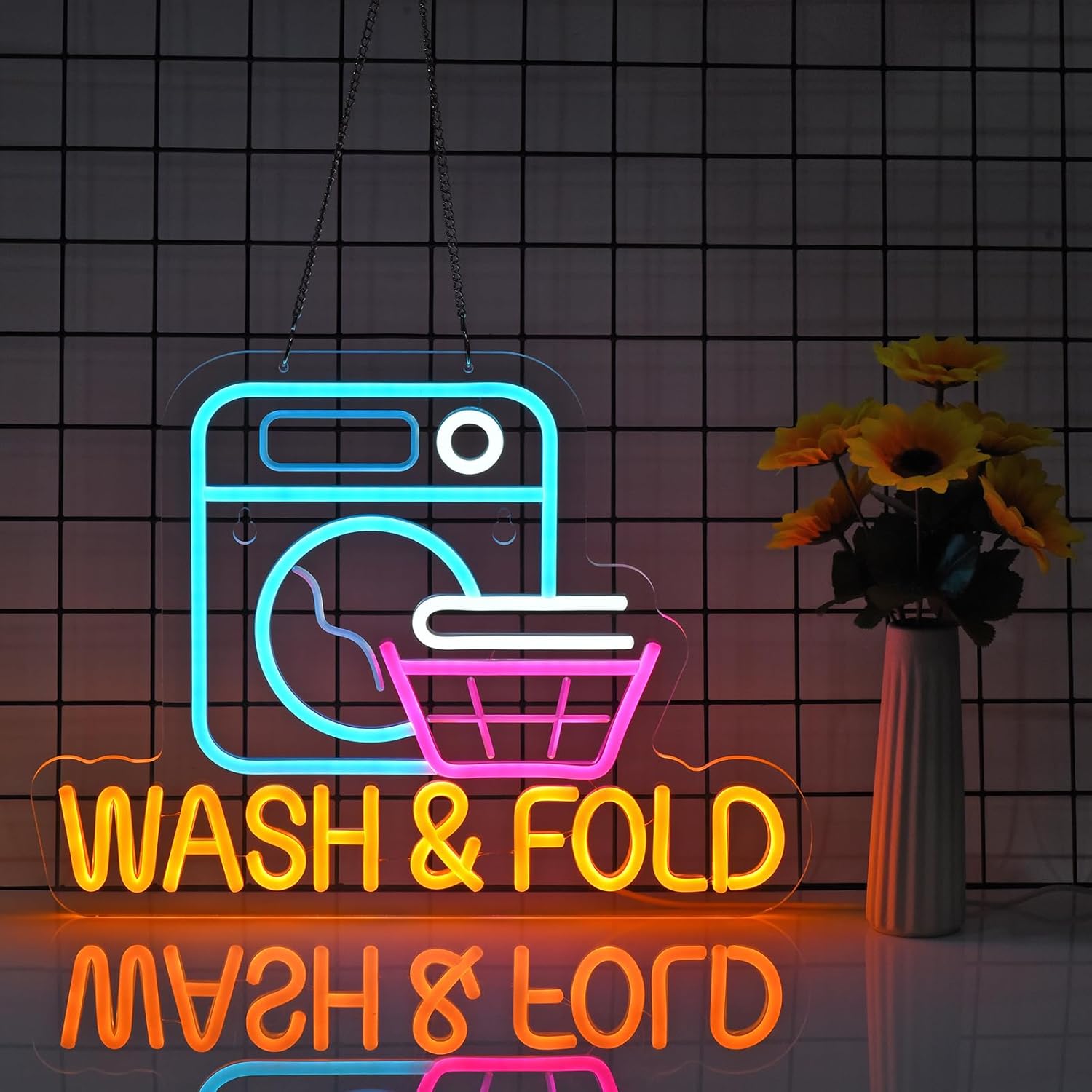 LED neon sign of a washing machine and laundry basket with “WASH & FOLD” text