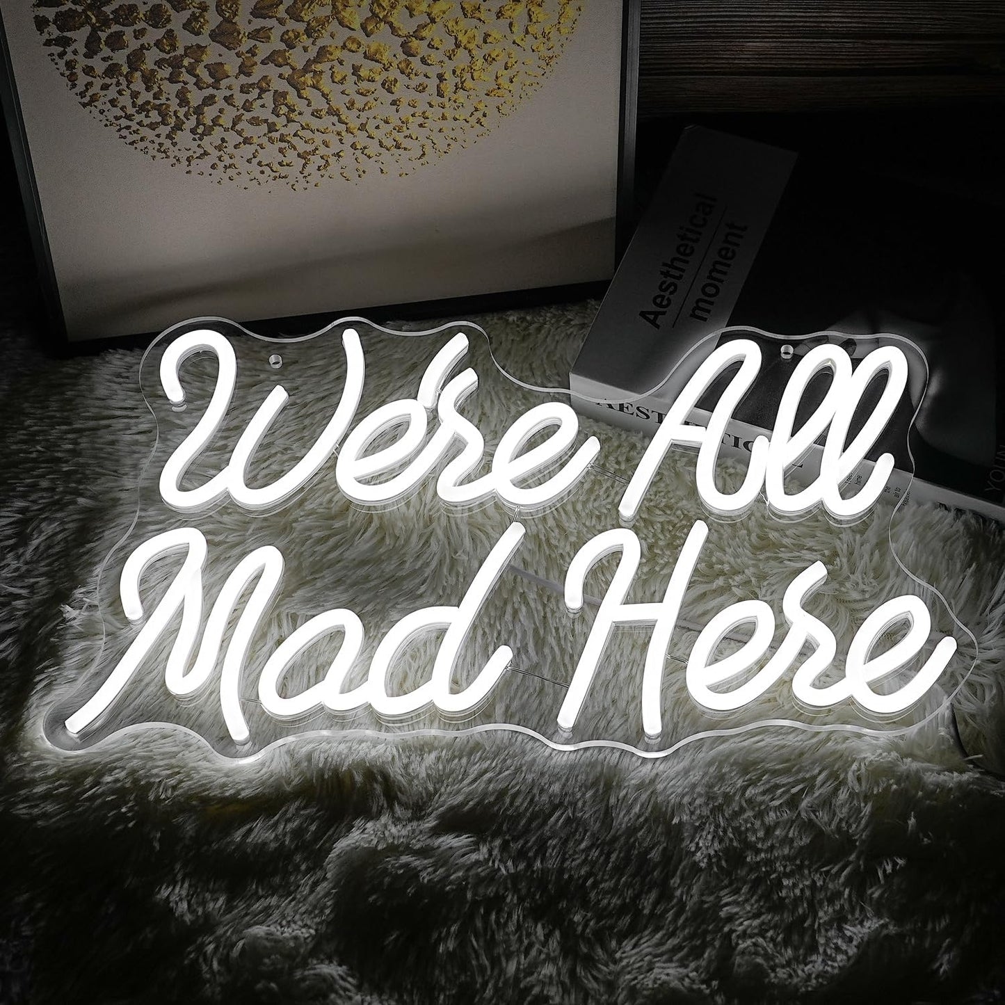 White LED neon sign with ‘We’re All Mad Here’ text – fun wall decor inspired by Alice in Wonderland