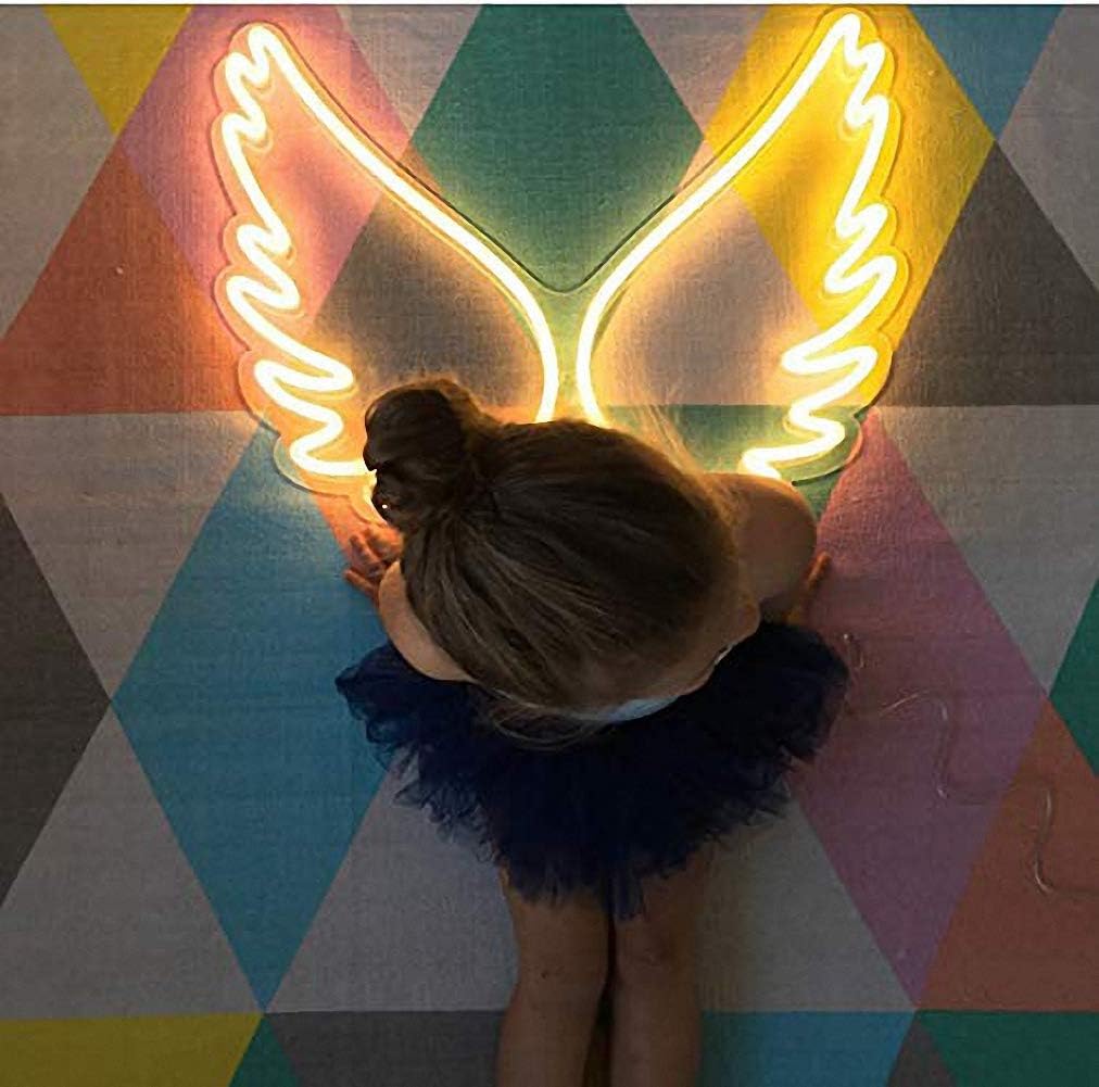 Glowing angel wings neon sign wall light – perfect for bedroom or studio decor

