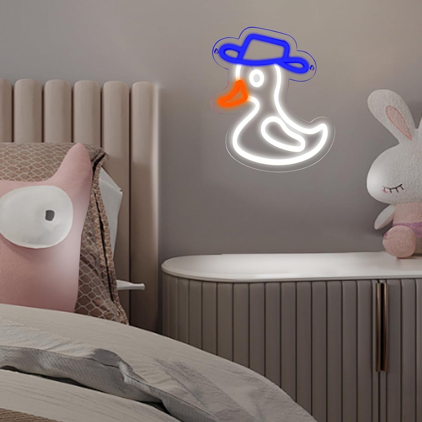 Cute duck neon sign wearing a blue hat, glowing on wall decor