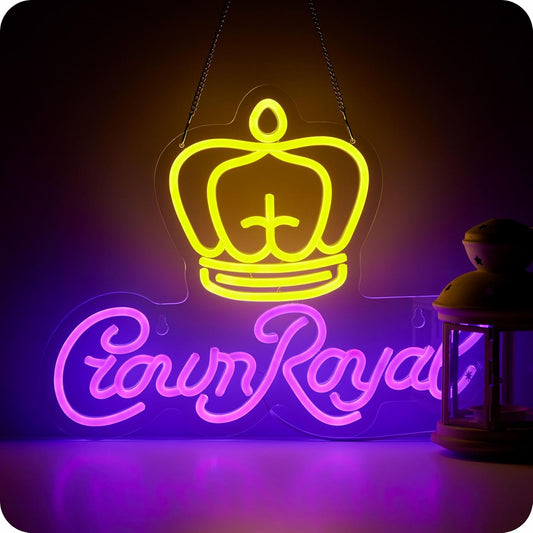 Crown Royal neon sign with yellow crown and purple cursive letters on black wall