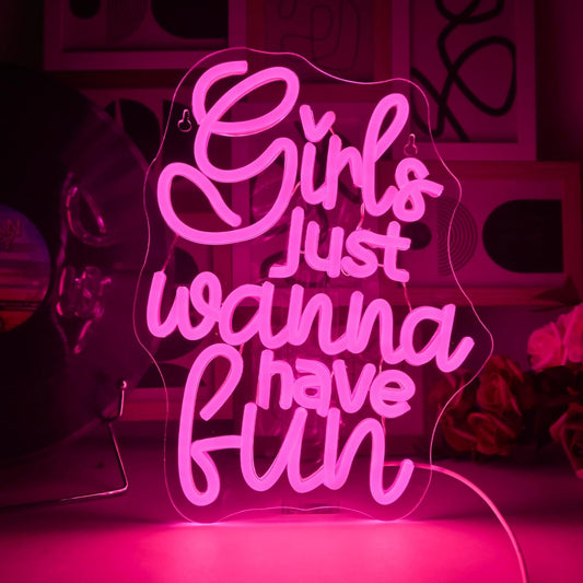 Bright neon sign spelling "Girls Just Wanna Have Fun" in LED, perfect for party rooms or bachelorette decor
