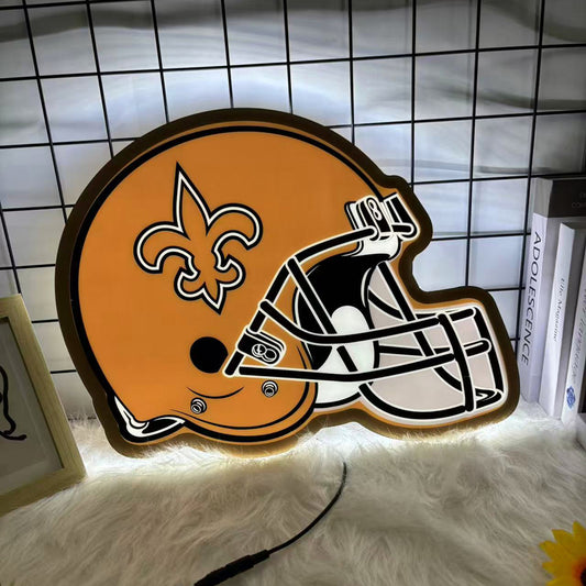 Golden football helmet LED neon sign with black fleur-de-lis emblem, glowing wall decor for game rooms and man caves.