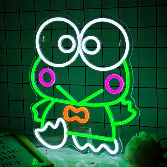 Green frog character neon sign with large eyes and pink cheeks, cute cartoon LED wall decor for kids room or kawaii spaces