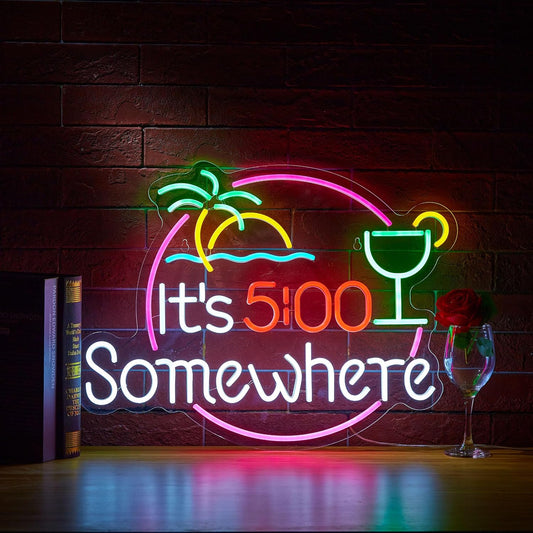 It’s 5:00 Somewhere neon sign with cocktail glass, sunset, and palm trees