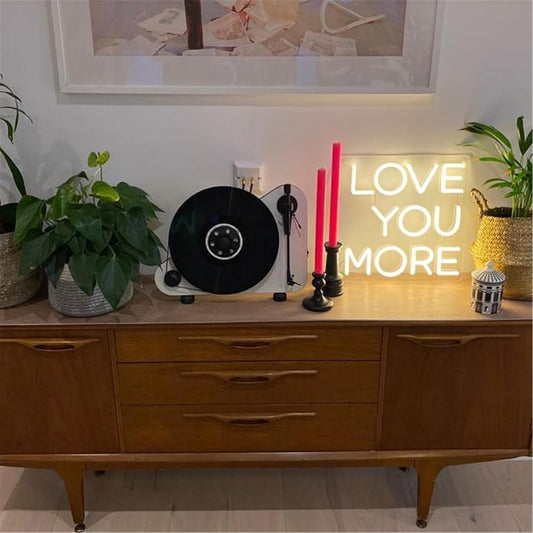 LED neon sign with the words ‘Love You More’ in bright script – romantic wall decor
