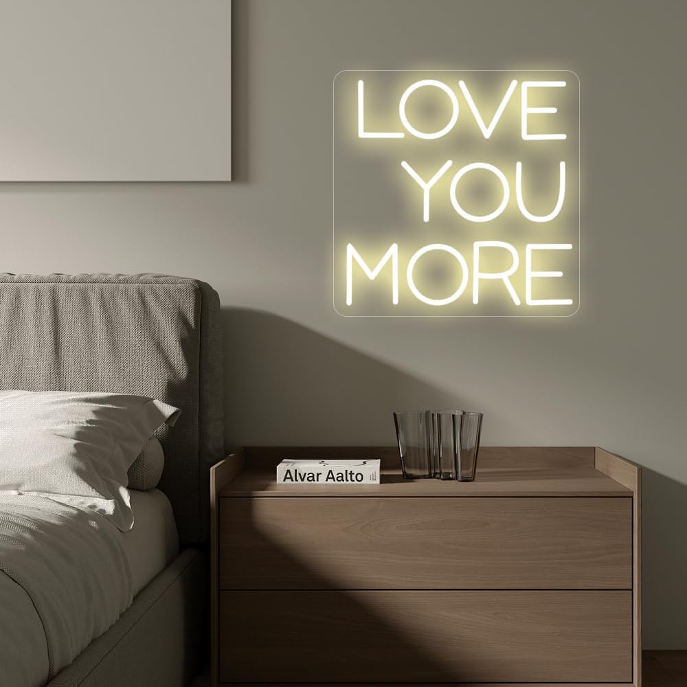 LED neon sign with the words ‘Love You More’ in bright script – romantic wall decor