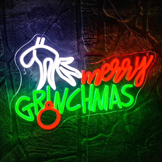 Merry Grinchmas neon sign with a hand holding ornament in red, green, and white LED lights for holiday decor