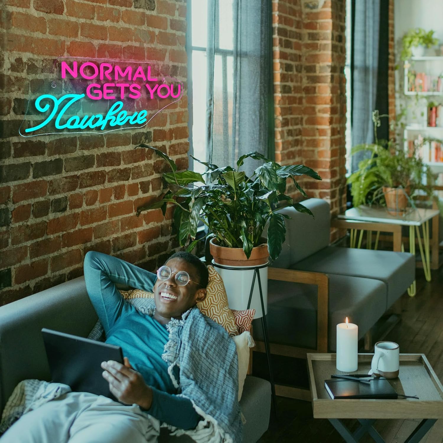 LED neon sign reading "Normal Gets You Nowhere" glowing on a clear backing, ideal for creative interior decor