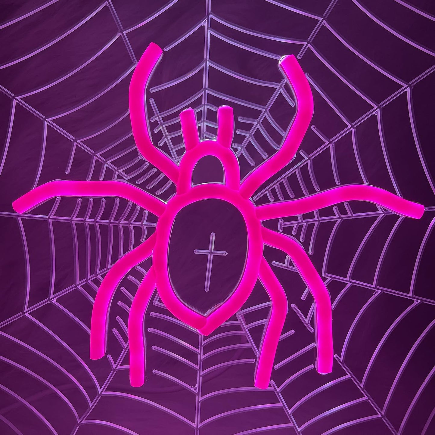 Neon sign of a spider sitting in the center of a spiderweb with UV-printed detail, gothic and Halloween-themed room decor