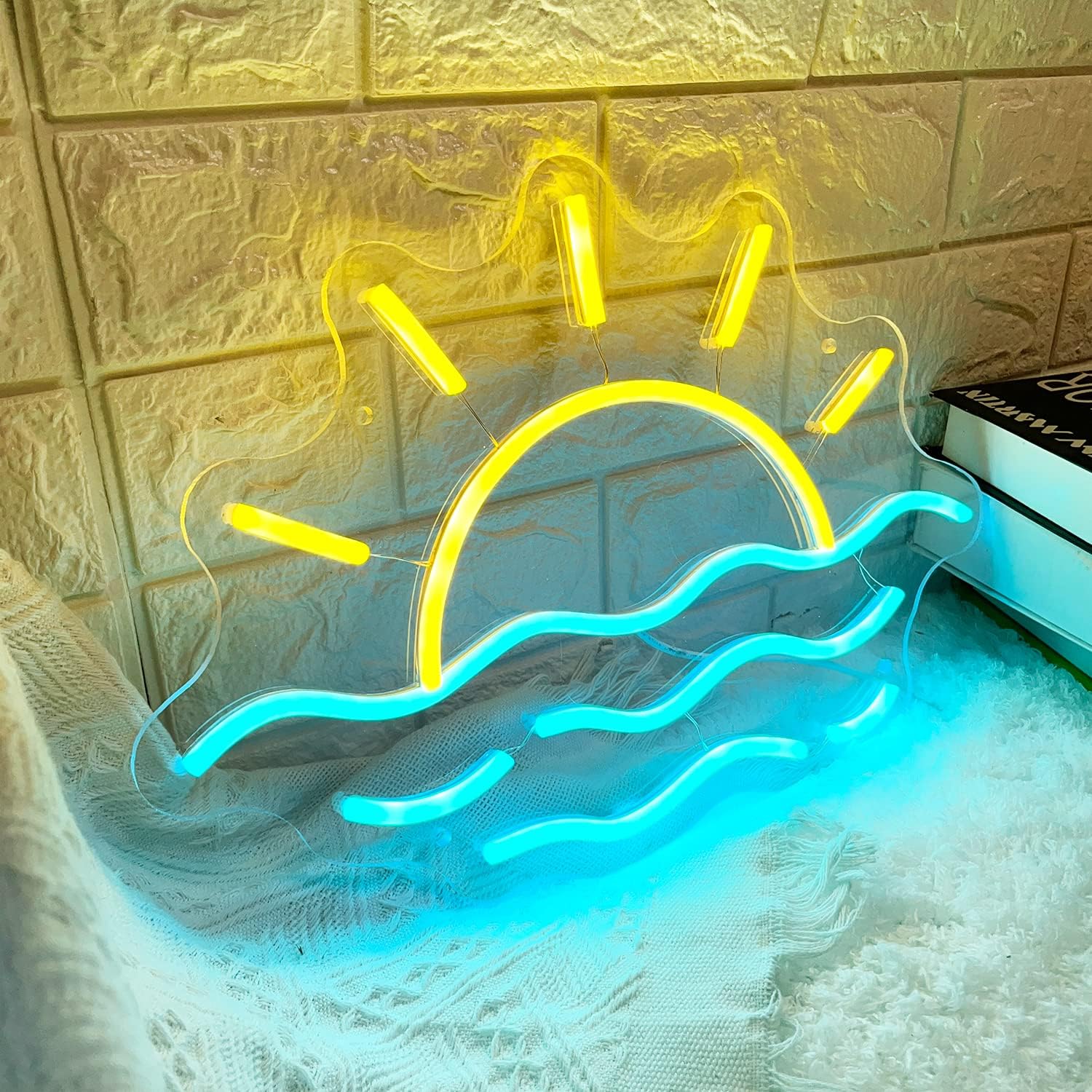 LED neon sign of a sunrise or sunset over the ocean, glowing wall decor