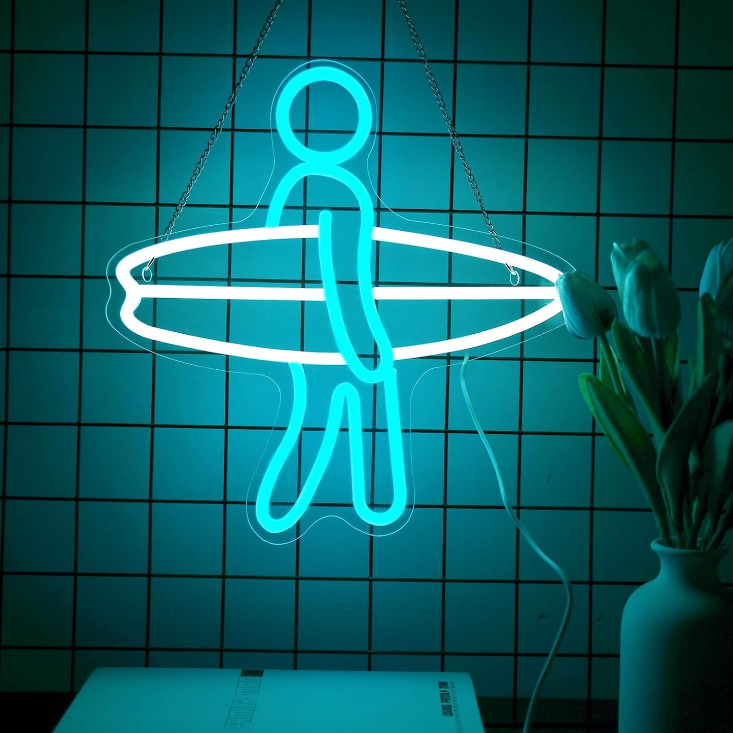 LED neon sign of a surfer holding a surfboard, glowing wall decor for beach lovers and surf-themed rooms
